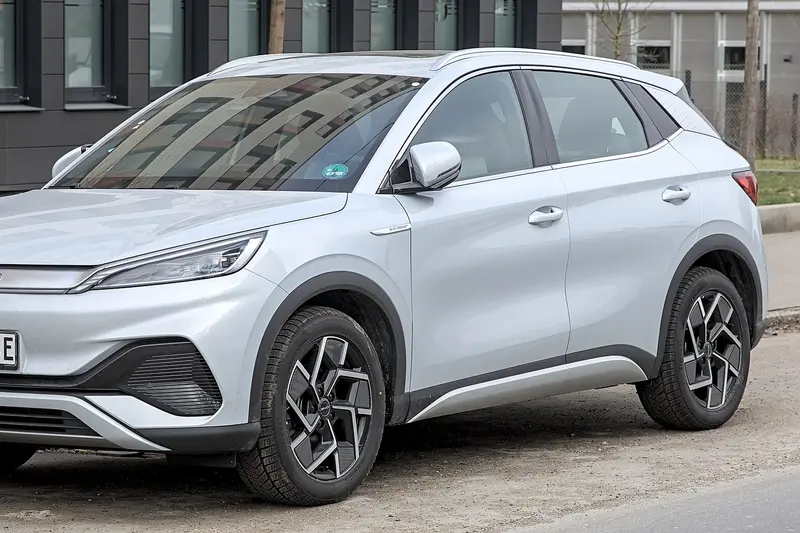 Silver BYD ATTO 3 electric SUV parked on a street, front three-quarter view