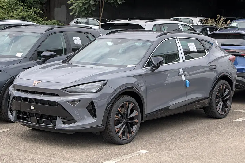 Grey CUPRA Formentor crossover in a parking lot, front three-quarter view